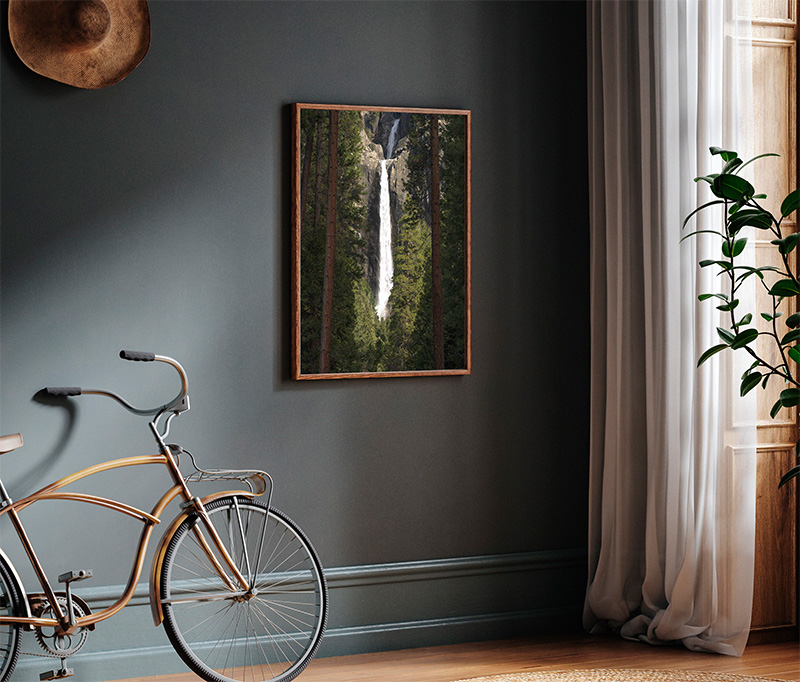 Yosemite Falls on display near a bike and a window.